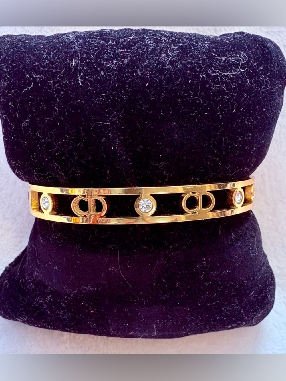 Gold-Tone Interlocking Circle Bracelet with Black Enamel and Crystals